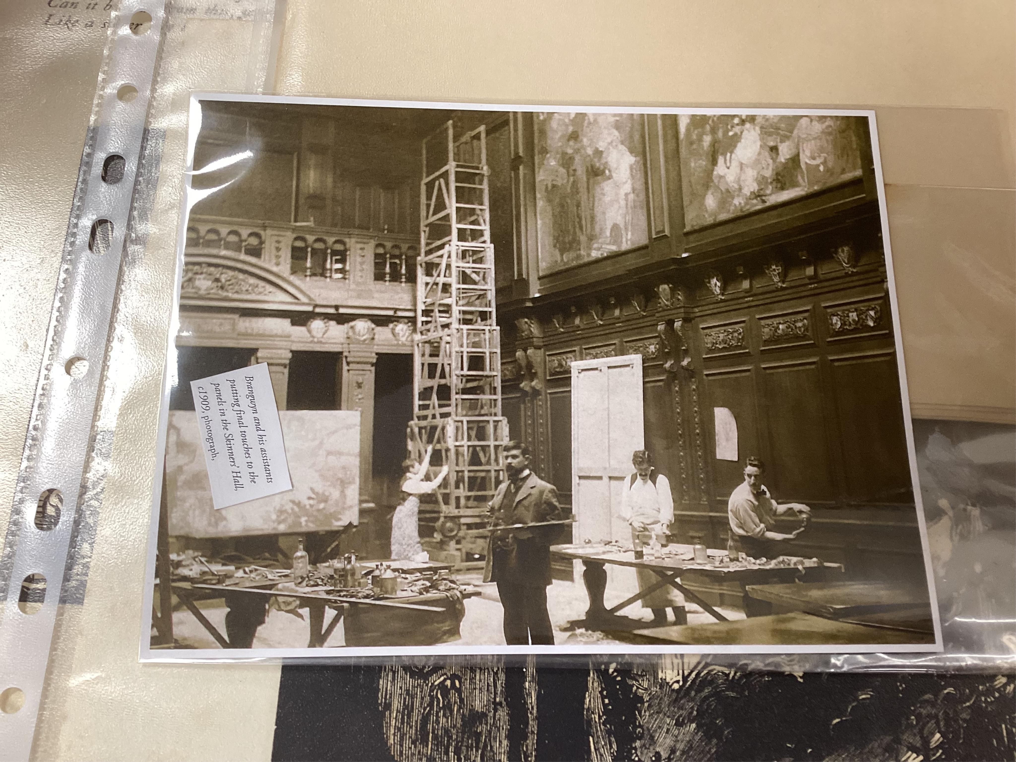 After Frank Brangwyn RA RWS RBA (1867-1956), a collection of unframed etchings and book plates to include Poem by JC Squire, together with related photographs inclduing Brangwyn in his studio